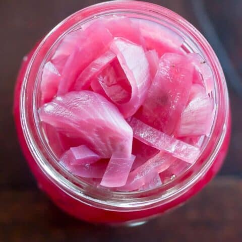 Tangy pickled red onions add so much flavor to tacos, burgers, and more.