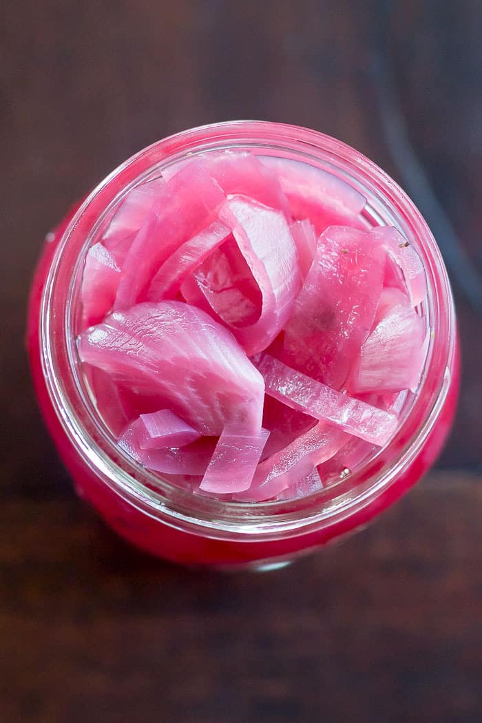 Tangy pickled red onions add so much flavor to tacos, burgers, and more.