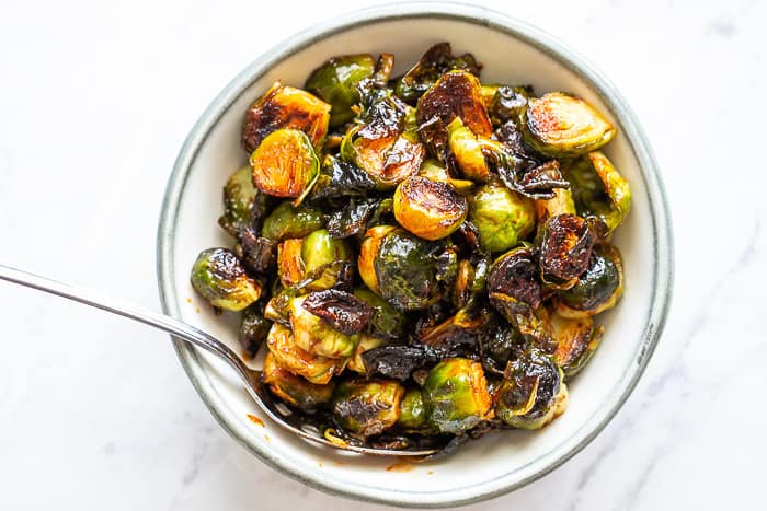 Spicy glazed brussels sprouts are full of fiery flavor. Pair them with grilled meats.