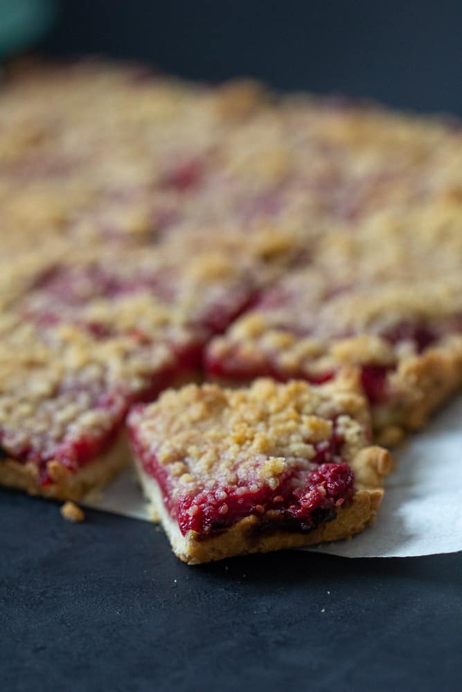 Raspberry pie bars sliced corner