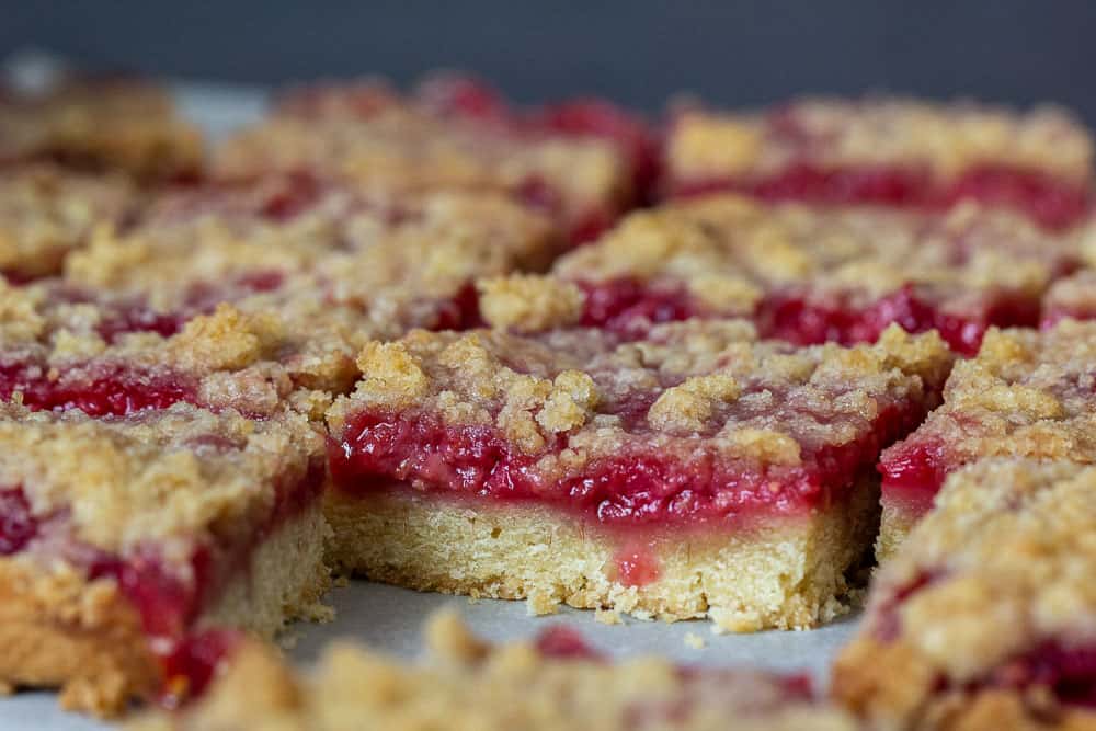 Sliced raspberry pie bars close up