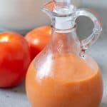 Roasted tomato salad dressing in cruet vertical