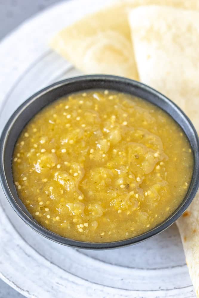 Tomatillo salsa in a bowl close up.