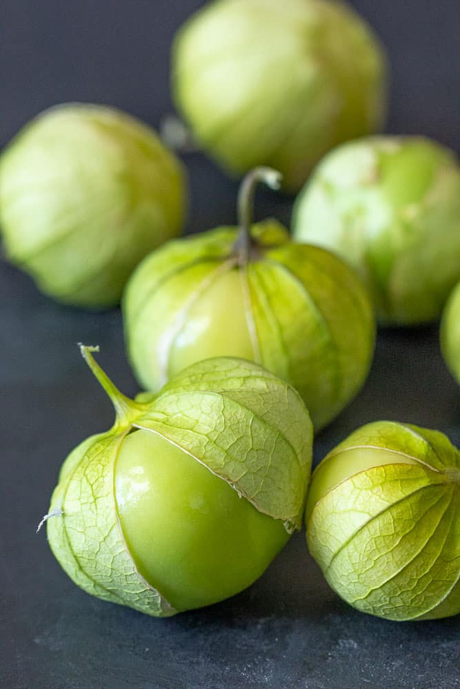 Tomatillos on black background