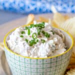 Bacon onion dip in a green and white bowl