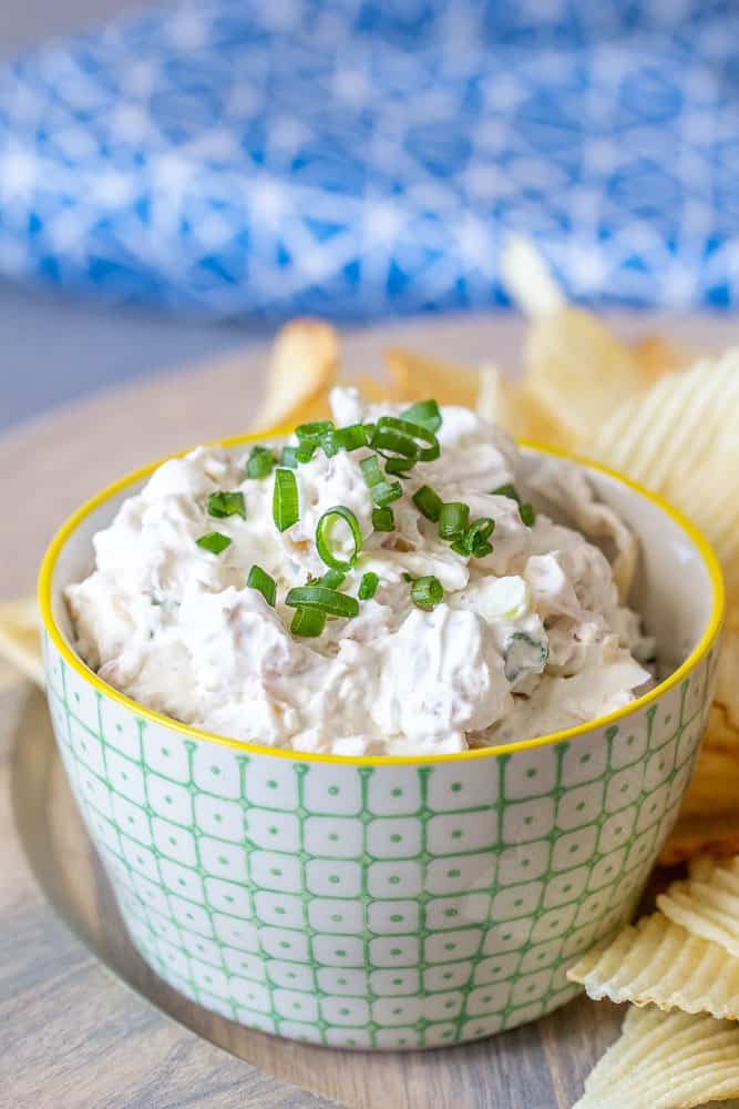 Bacon onion dip in a green and white bowl
