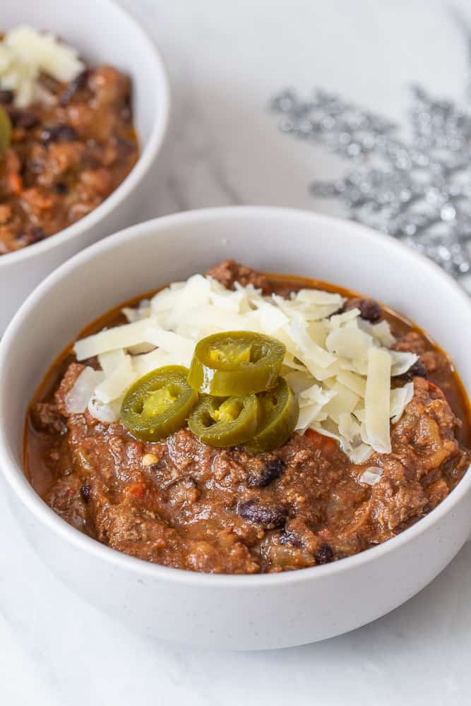 beef chili close up with cheese and jalapenos