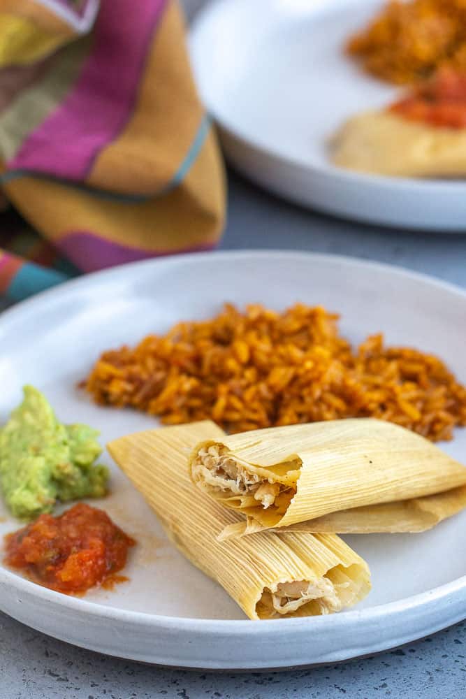 Homemade Pork Tamales are easier to make than you would think and are delicious when served with green, red, or mole sauce. Invite your friends over for a tamale-making party and make a whole batch! 