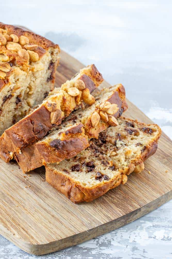 sliced banana bread with chocolate. chips and nuts on top