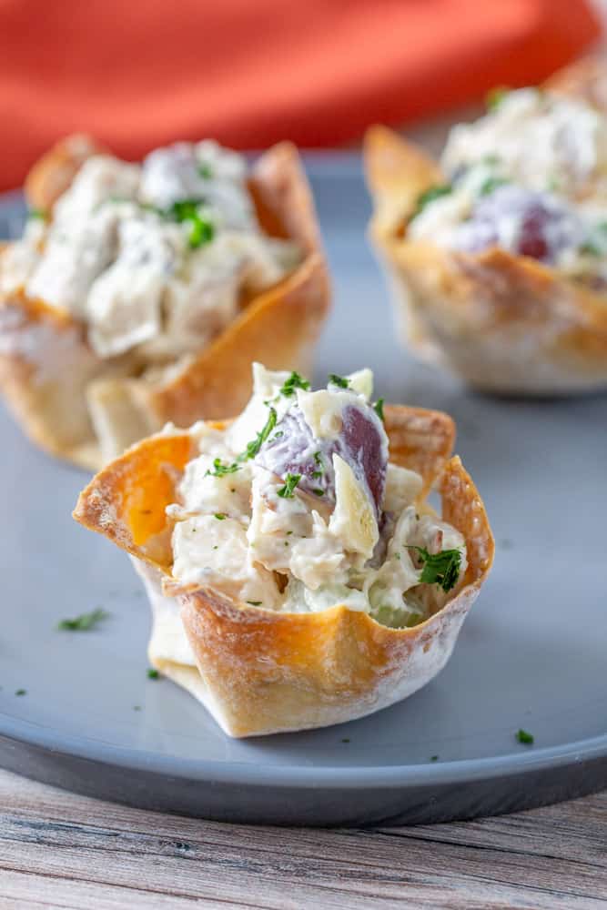 close up chicken salad wonton cups on plate