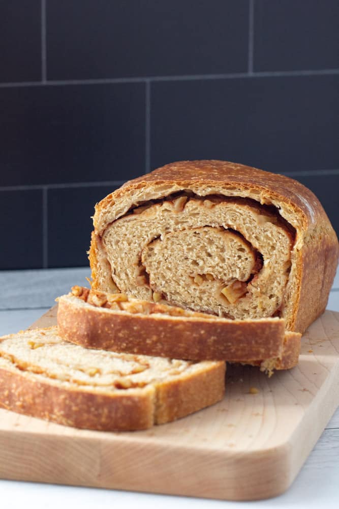 Sliced apple cinnamon swirl bread on a cutting board