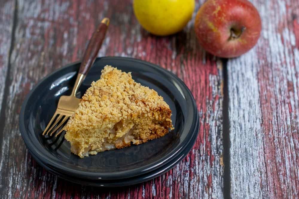 slice of apple coffee cake on a plate with a fork