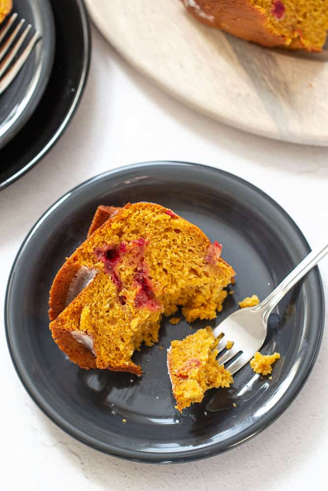 slice of pumpkin bundt cake with a fork, overhead