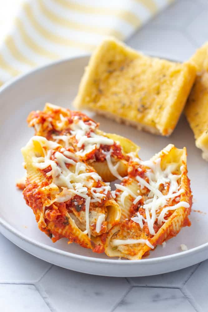 close up stuffed shells with chicken on a plate