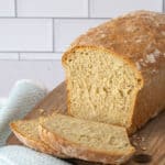 sliced honey oatmeal bread on a cutting board