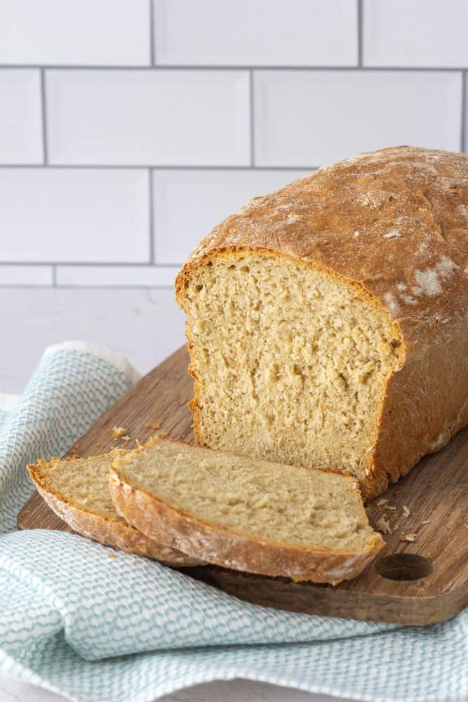 sliced honey oatmeal bread on a cutting board