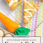 Delicious Carrot Cake Scones topped with creamy cream cheese glaze.