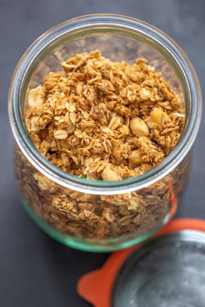 overhead peanut butter granola in a glass jar