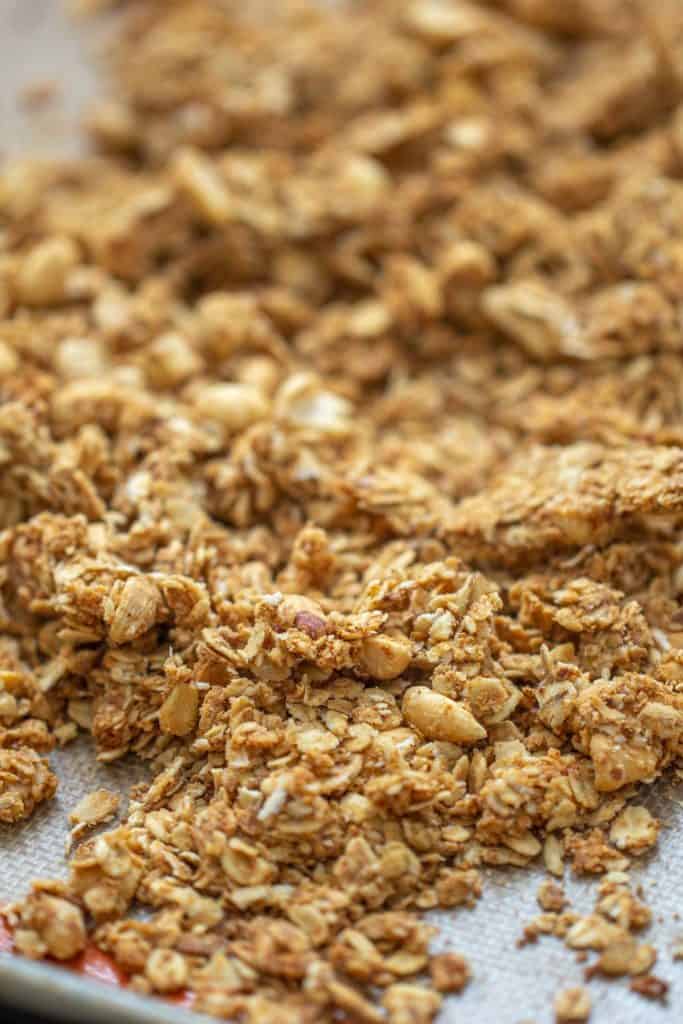 close up of baked granola on a sheet pan