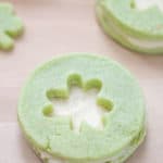 close up of pistachio pudding cookie sandwich with shamrock cutout