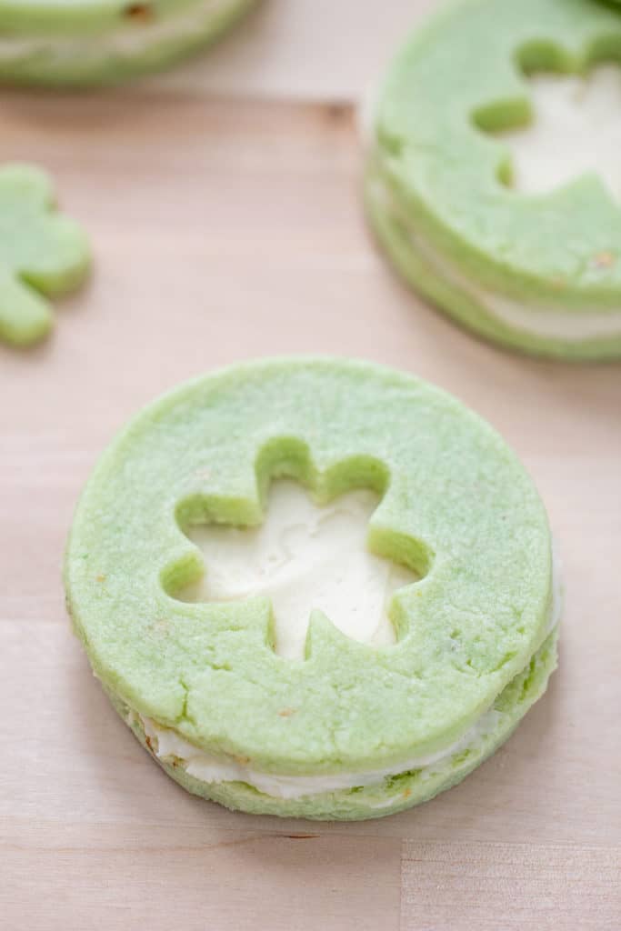 close up of pistachio pudding cookie sandwich with shamrock cutout