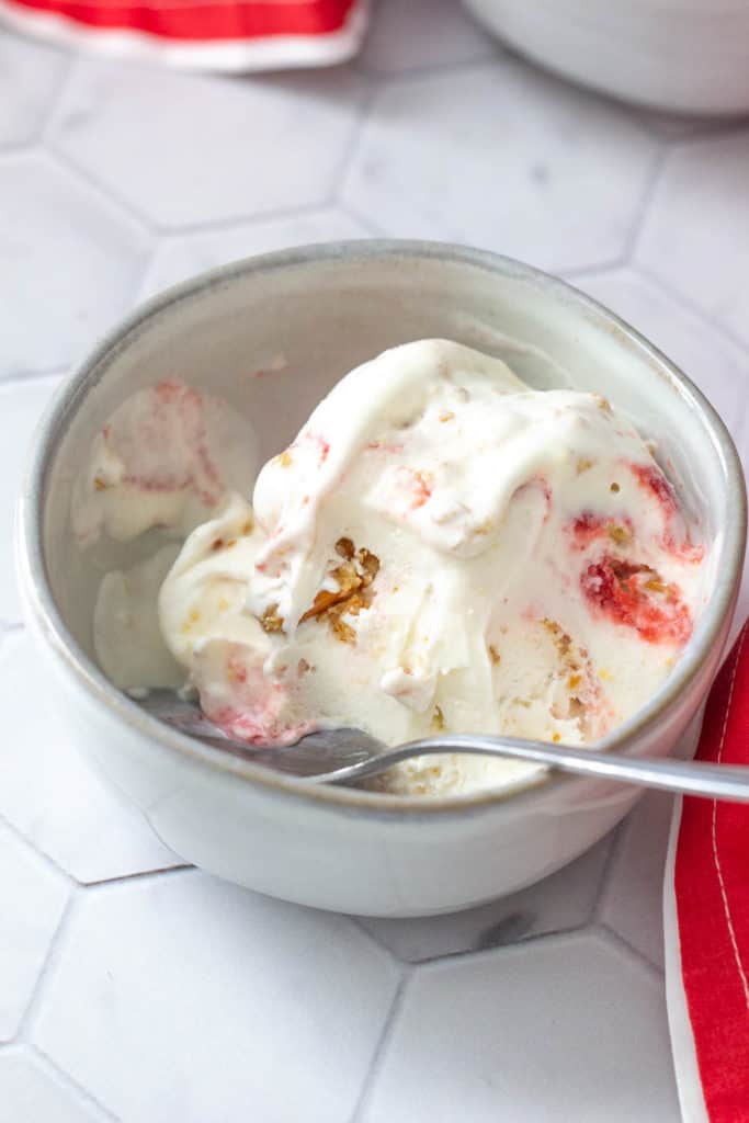 strawberry pretzel ice cream half eaten with spoon