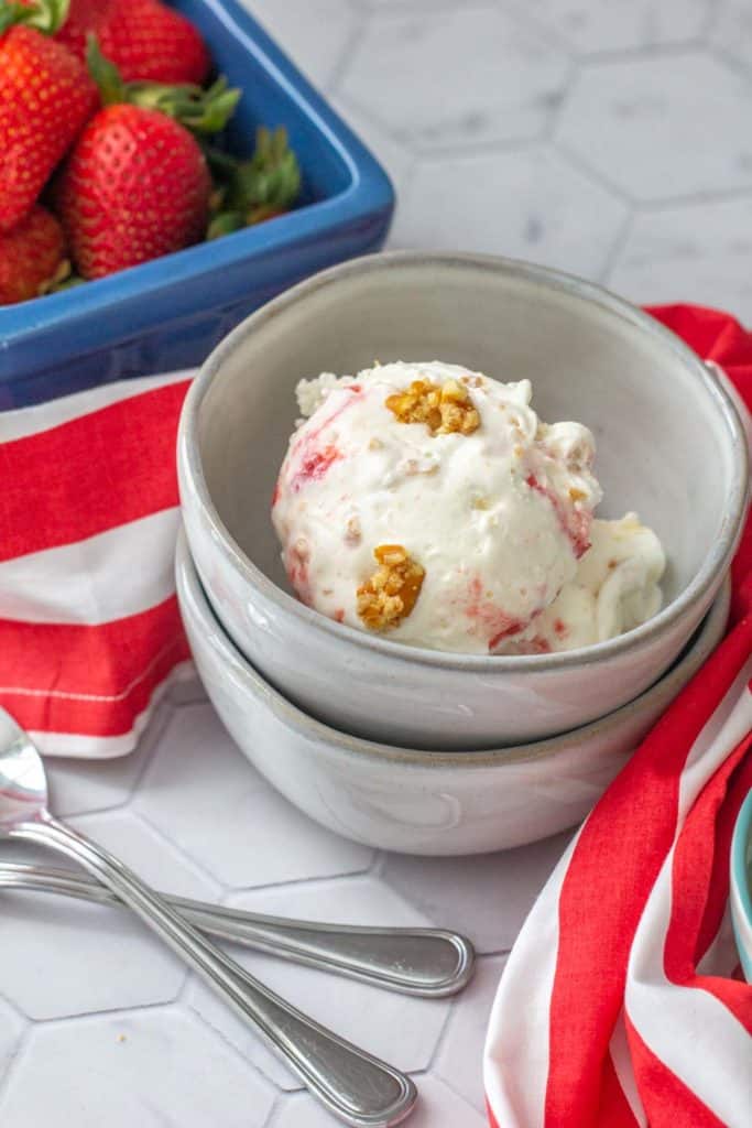 bowl of strawberry pretzel ice cream with spoons
