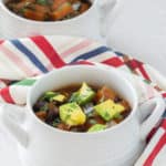 sweet potato black bean chili in white soup bowls