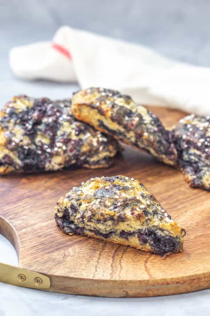 black raspberry scones on wooden tray