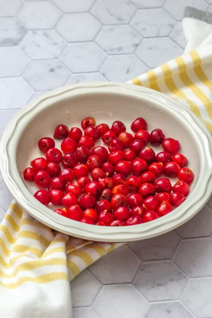 tart cherries in a pie plate