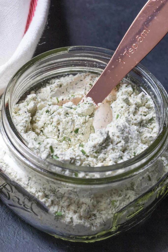 jar of ranch seasoning with measuring spoon