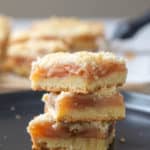 stacked apple pie bars on black plate