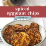 A bowl of crispy eggplant chips sits on a white surface, with a whole eggplant and a glass bowl in the background. Text overlay reads "spiced eggplant chips.