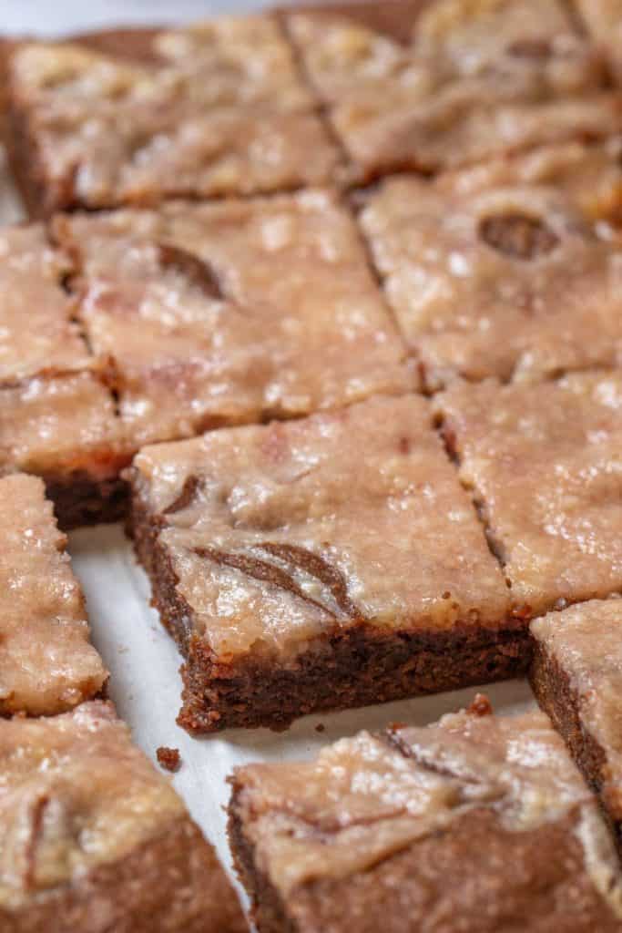 pan of cut strawberry cheesecake swirl brownies