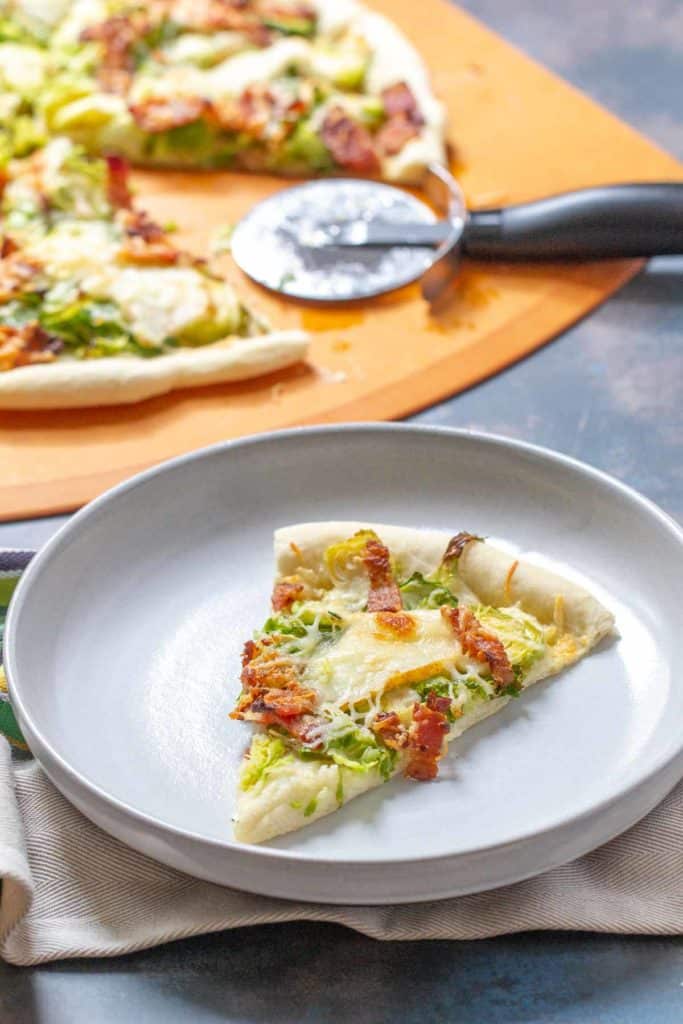 slice of brussels sprouts pizza on a plate