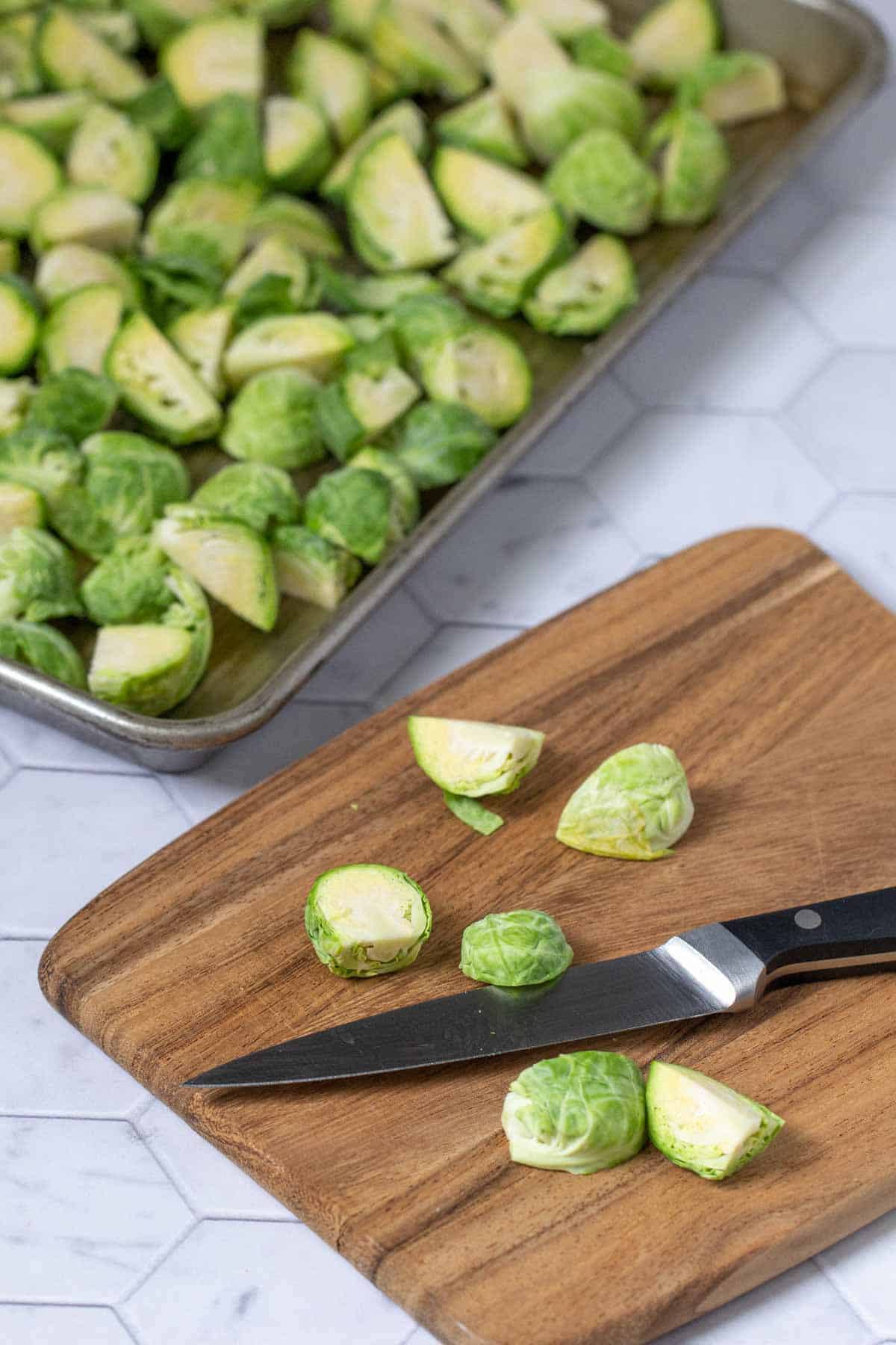 cutting board with brussels sprouts and knife