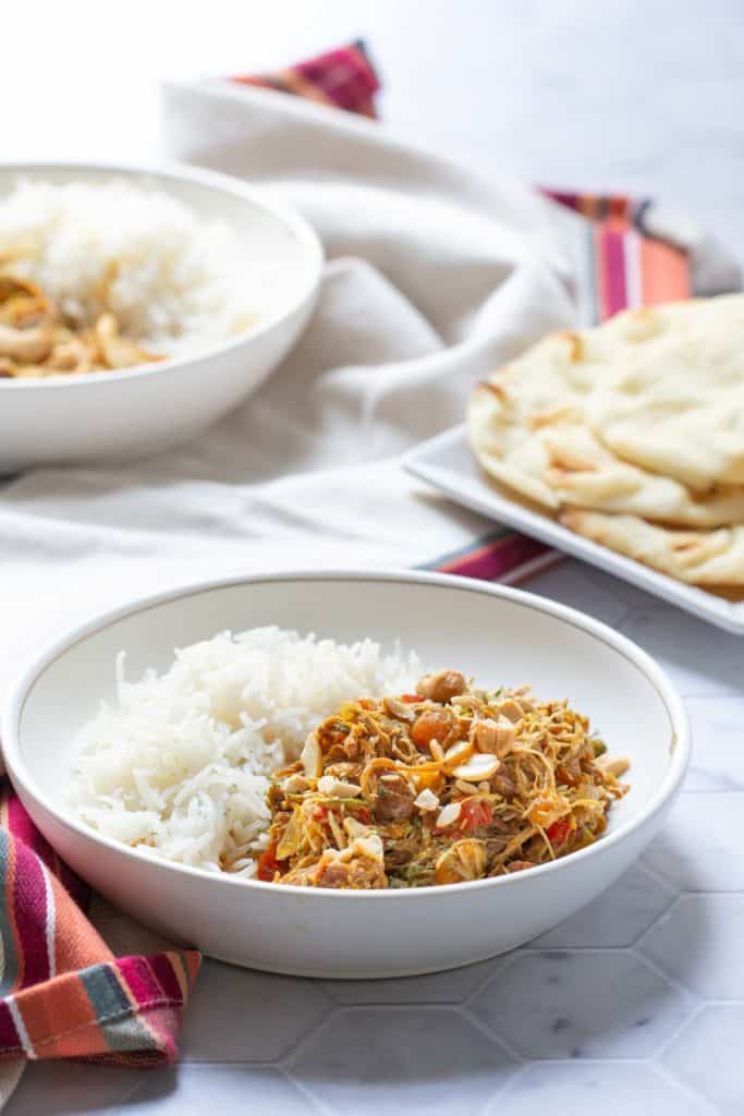 bowls of curried chicken and rice