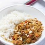 rice and curried chicken in a bowl