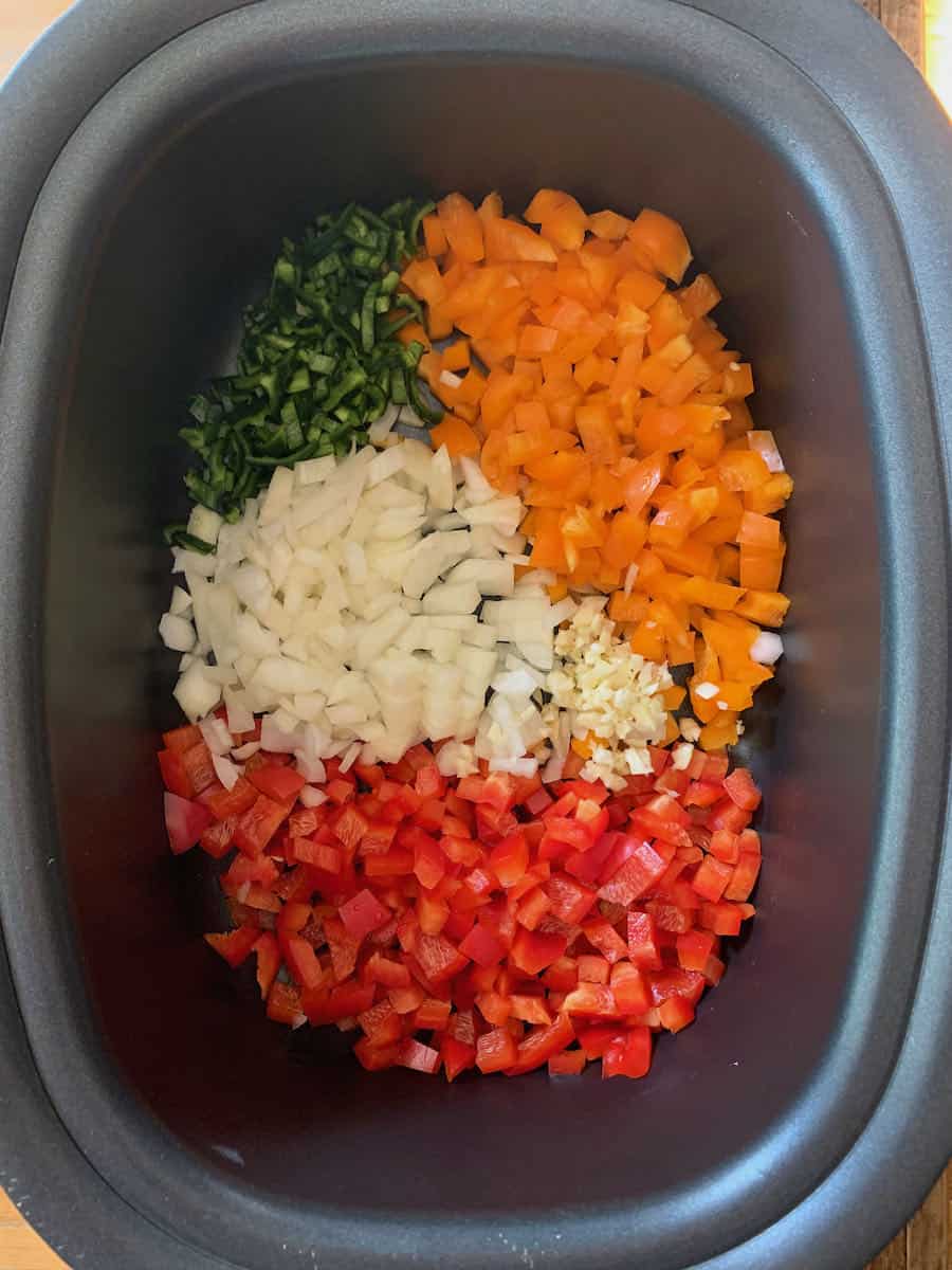 chopped vegetables for curried chicken in slow cooker