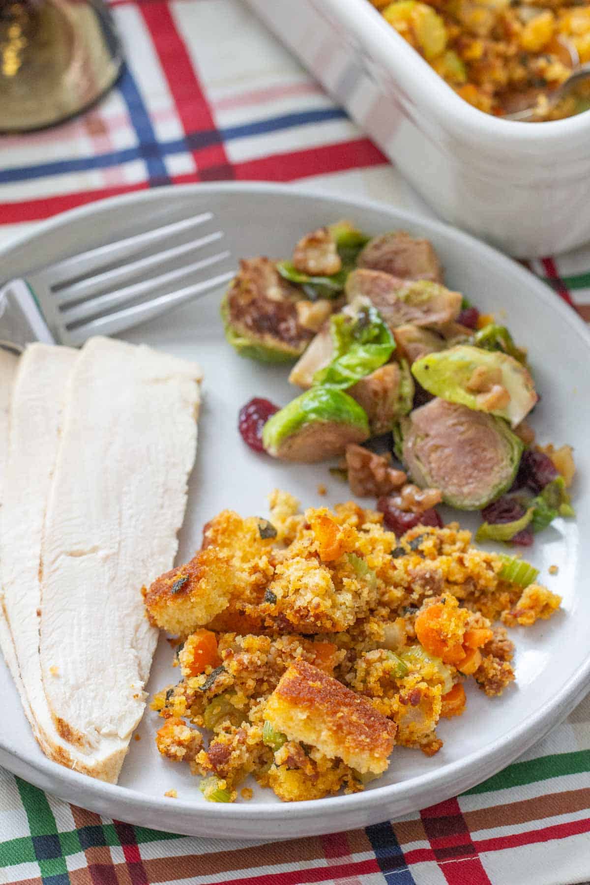 plate with chorizo cornbread stuffing and holiday foods