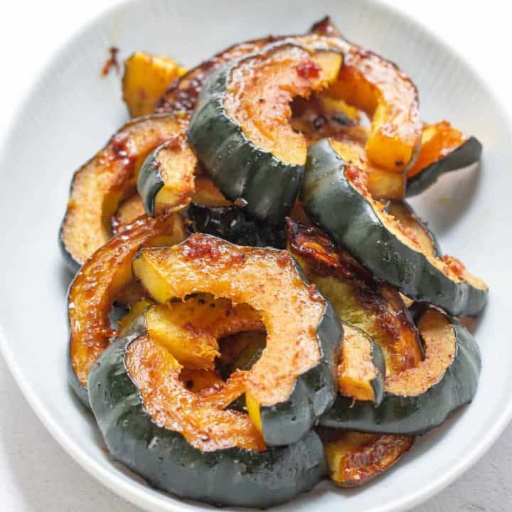 serving dish of glazed acorn squash