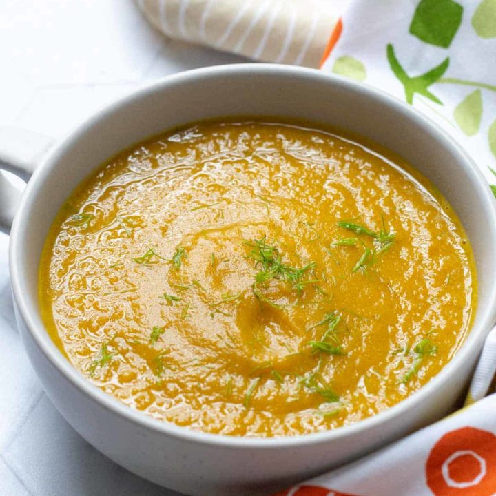 close up of roasted carrot fennel soup in a bowl