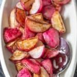 serving bowl of sauteed radishes with serving spoon