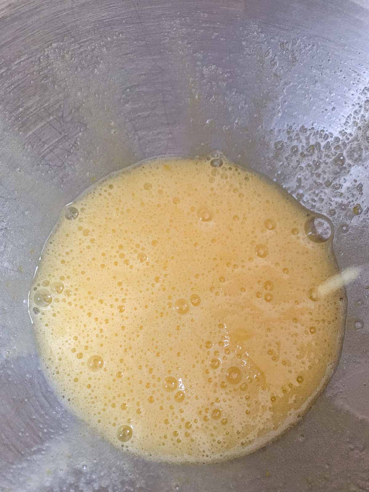 beaten eggs and sugar in mixing bowl