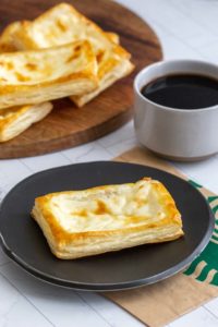 Starbucks cheese danish on black plate