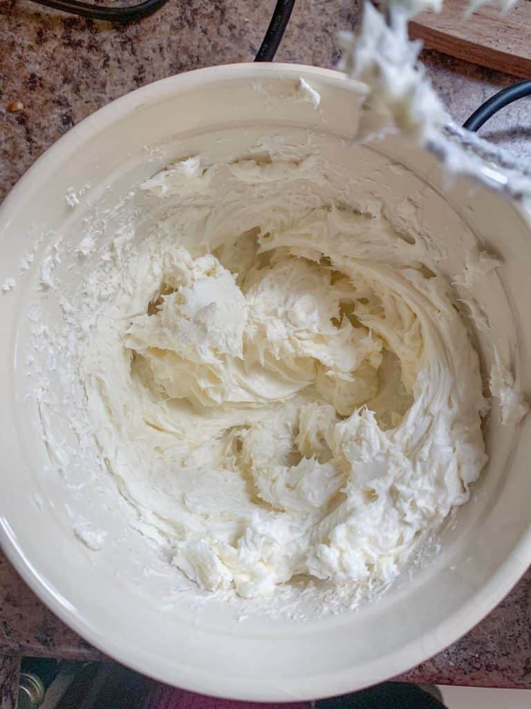 blended cream cheese and sugar in mixing bowl