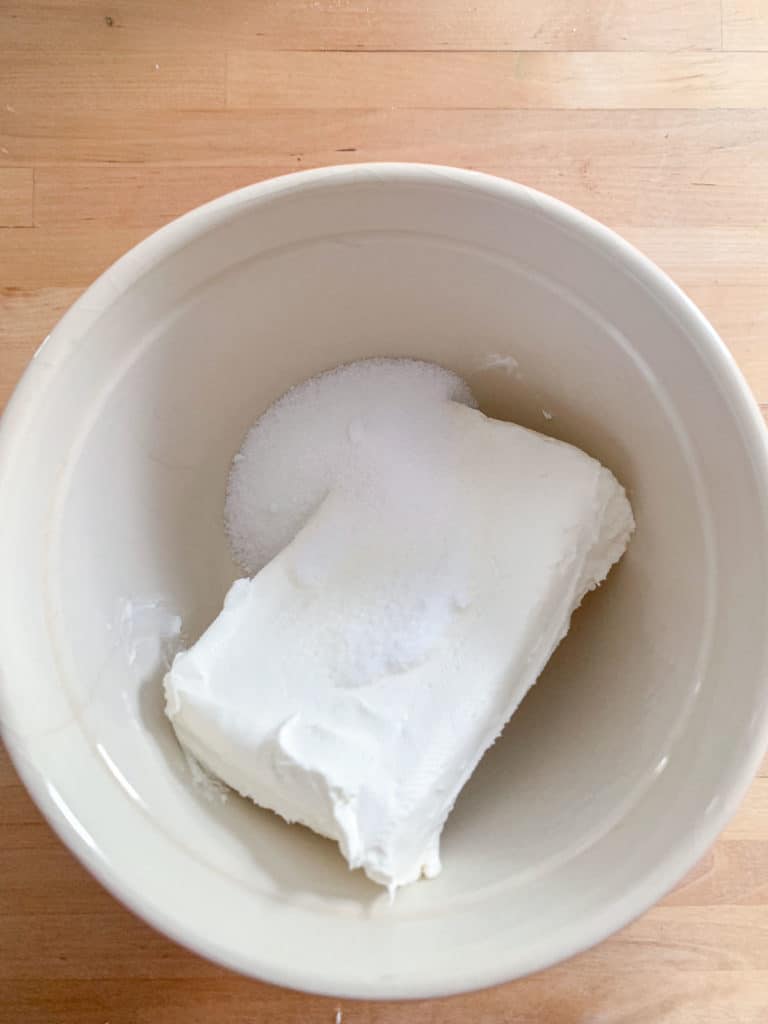 cream cheese and sugar in mixing bowl