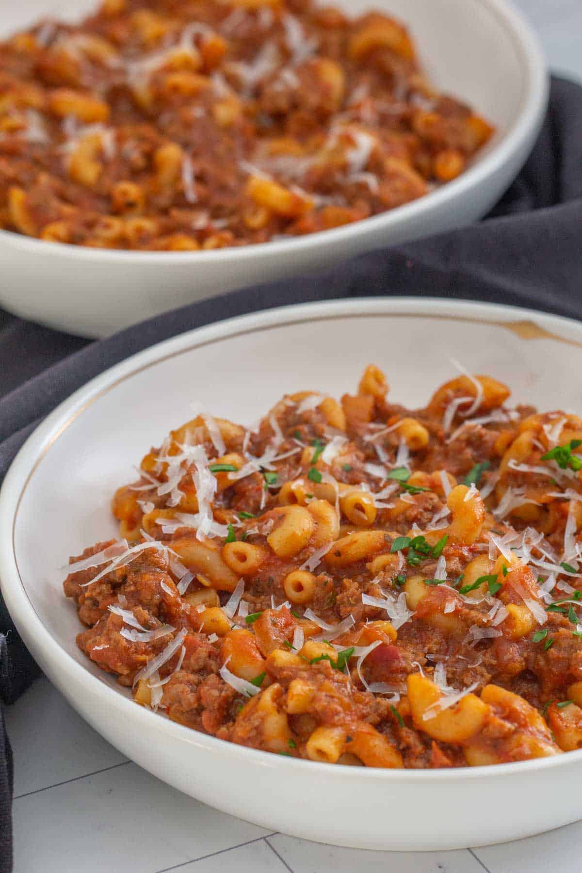 close up of American goulash in two bowls
