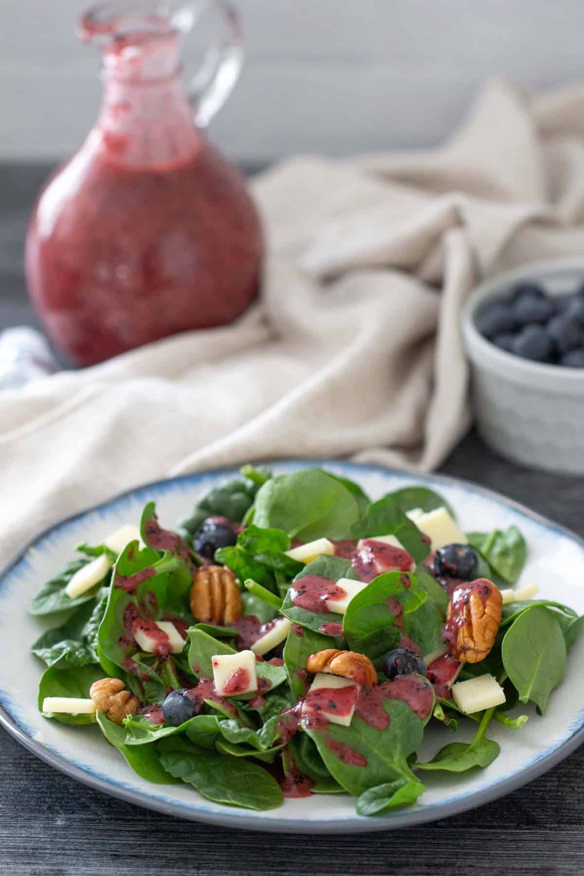 spinach salad dressed with blueberry vinaigrette
