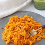 carrot salad on metal plate with fork